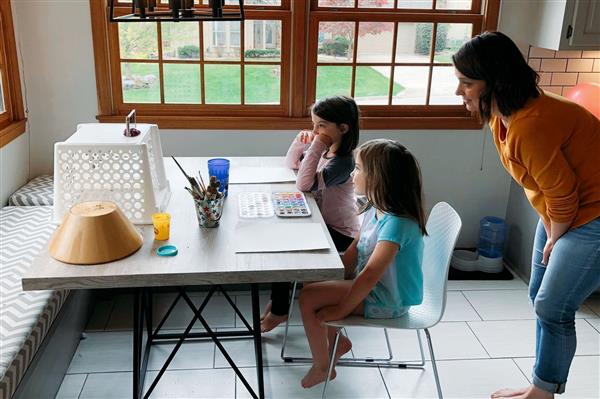 Two children at table working at home Two children at table working at home